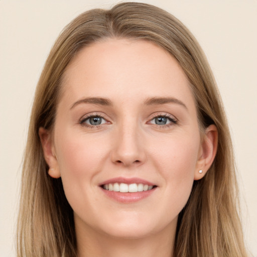 Joyful white young-adult female with long  brown hair and grey eyes