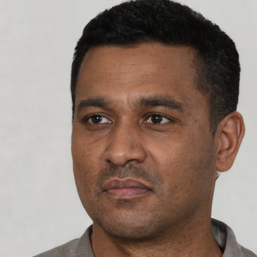 Neutral black adult male with short  black hair and brown eyes