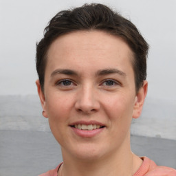 Joyful white young-adult female with short  brown hair and grey eyes