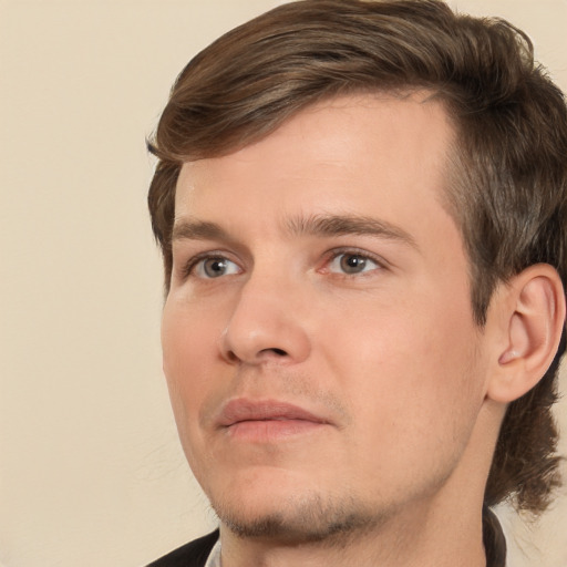 Joyful white young-adult male with medium  brown hair and brown eyes