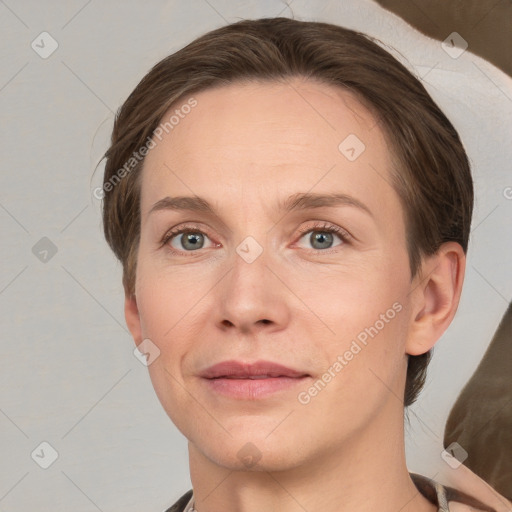 Joyful white adult female with medium  brown hair and grey eyes