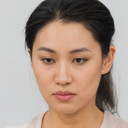 Neutral asian young-adult female with medium  brown hair and brown eyes