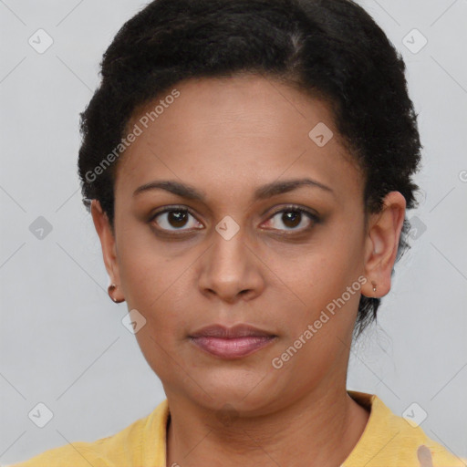 Joyful latino young-adult female with short  brown hair and brown eyes