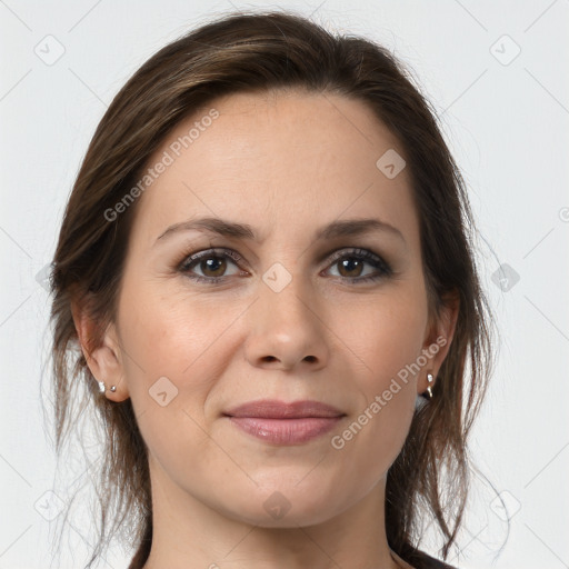 Joyful white young-adult female with medium  brown hair and grey eyes