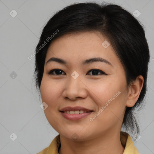 Joyful asian young-adult female with medium  brown hair and brown eyes