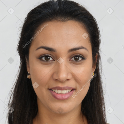 Joyful latino young-adult female with long  brown hair and brown eyes