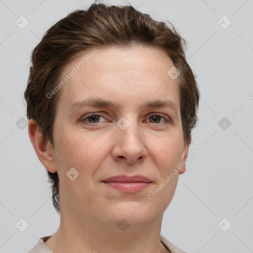 Joyful white adult female with short  brown hair and grey eyes