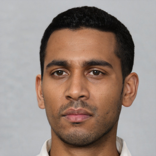Neutral latino young-adult male with short  black hair and brown eyes