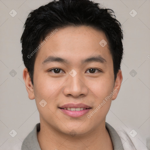 Joyful asian young-adult male with short  brown hair and brown eyes