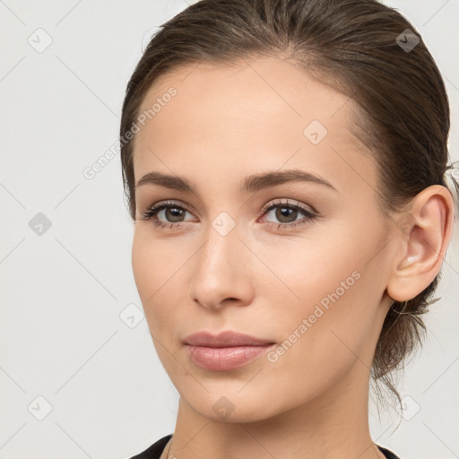 Neutral white young-adult female with medium  brown hair and brown eyes