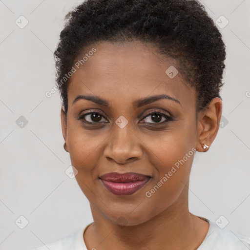 Joyful black young-adult female with short  brown hair and brown eyes