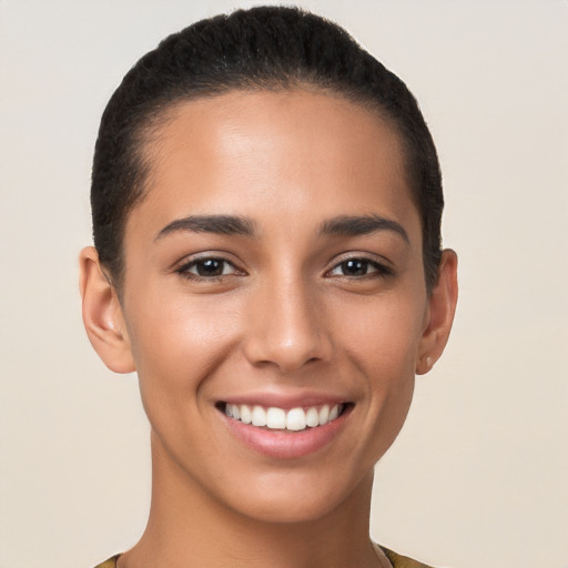 Joyful latino young-adult female with short  brown hair and brown eyes