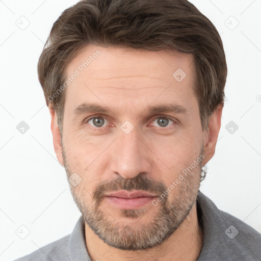 Joyful white adult male with short  brown hair and grey eyes