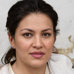 Joyful white adult female with medium  brown hair and brown eyes