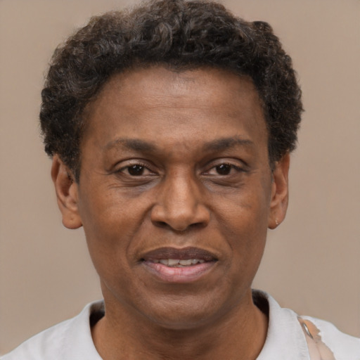 Joyful latino adult male with short  brown hair and brown eyes