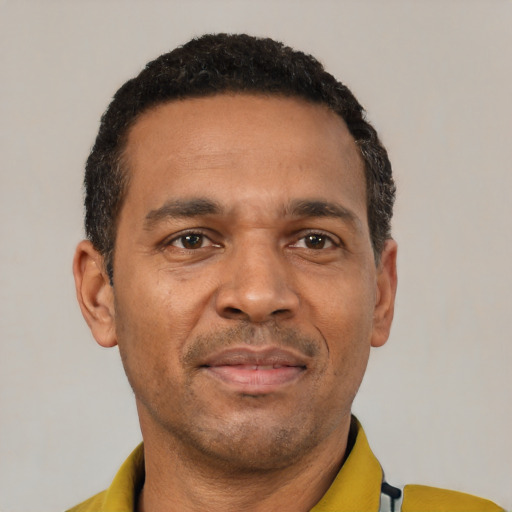Neutral latino adult male with short  black hair and brown eyes