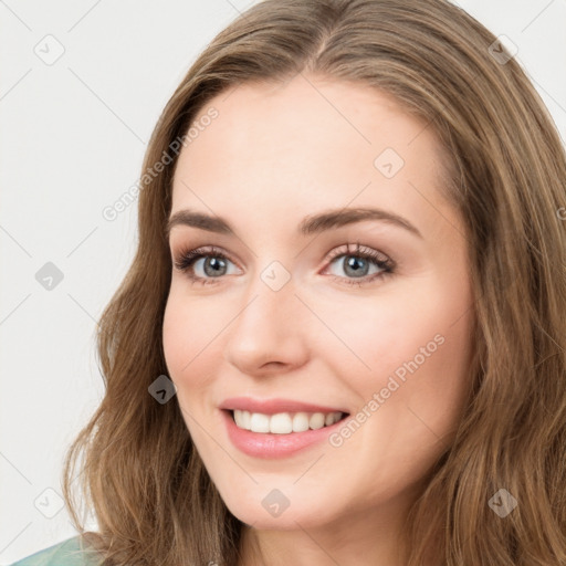 Joyful white young-adult female with long  brown hair and green eyes