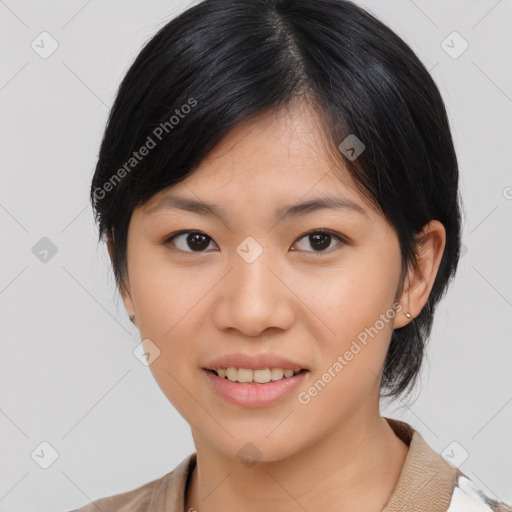 Joyful asian young-adult female with medium  black hair and brown eyes