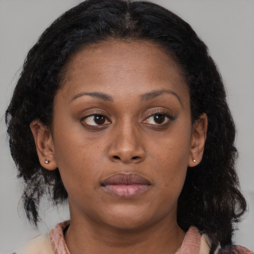 Neutral latino young-adult female with medium  brown hair and brown eyes