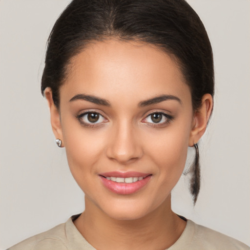 Joyful white young-adult female with medium  brown hair and brown eyes