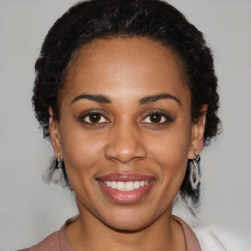 Joyful latino young-adult female with medium  black hair and brown eyes