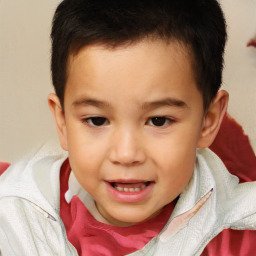 Joyful white child male with short  brown hair and brown eyes