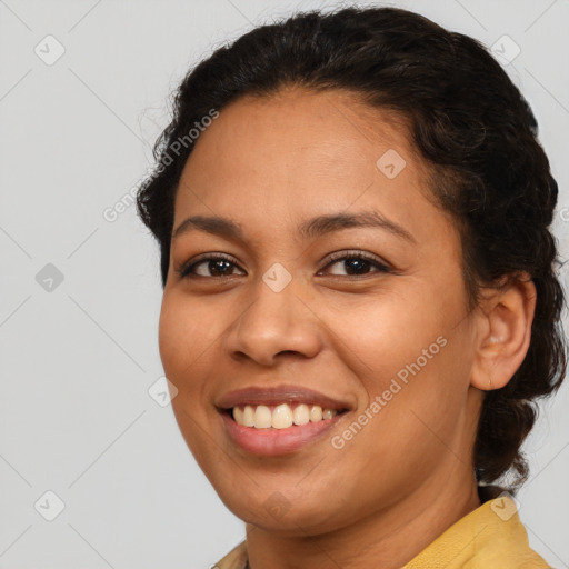 Joyful latino young-adult female with medium  brown hair and brown eyes