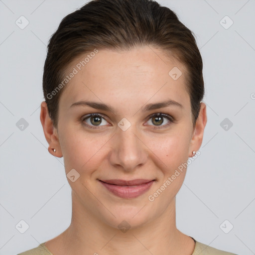 Joyful white young-adult female with short  brown hair and grey eyes