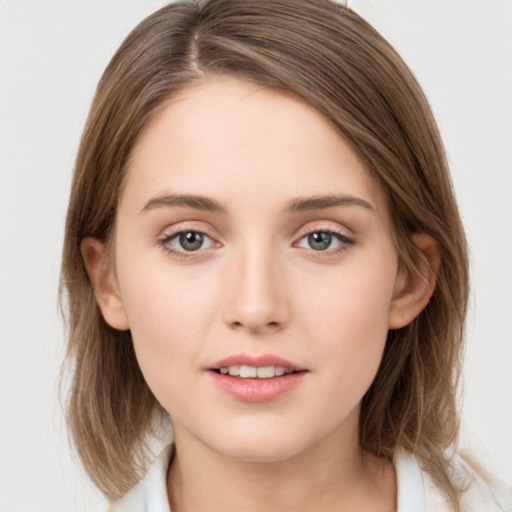 Neutral white young-adult female with medium  brown hair and grey eyes