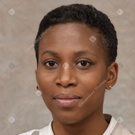 Joyful black young-adult female with short  black hair and brown eyes