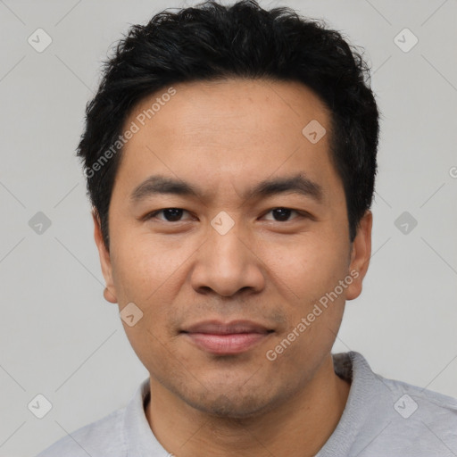 Joyful asian young-adult male with short  black hair and brown eyes