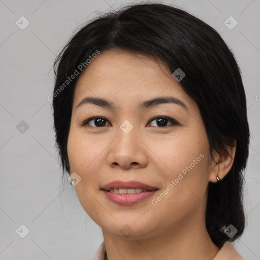 Joyful asian young-adult female with medium  brown hair and brown eyes