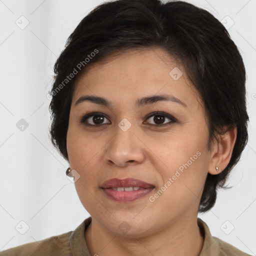 Joyful latino young-adult female with medium  brown hair and brown eyes