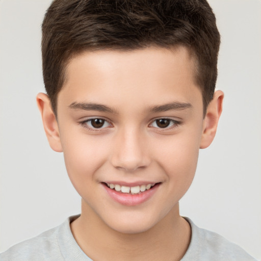 Joyful white child male with short  brown hair and brown eyes