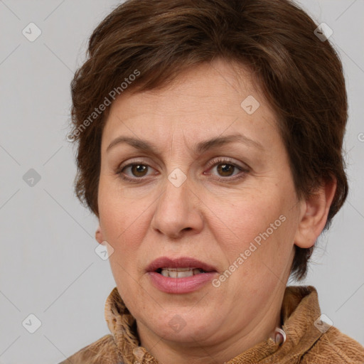 Joyful white adult female with medium  brown hair and brown eyes