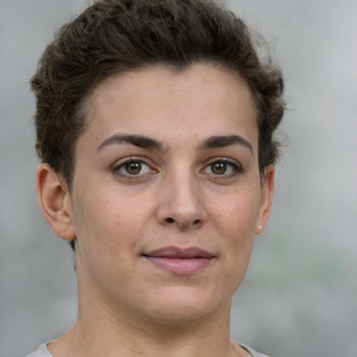 Joyful white young-adult female with short  brown hair and grey eyes