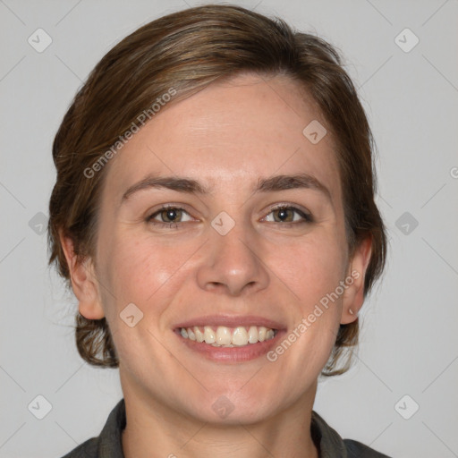 Joyful white adult female with medium  brown hair and grey eyes