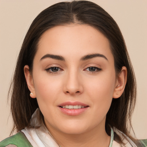 Joyful white young-adult female with long  brown hair and brown eyes