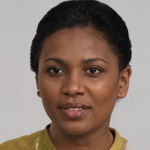 Joyful black young-adult female with short  brown hair and brown eyes