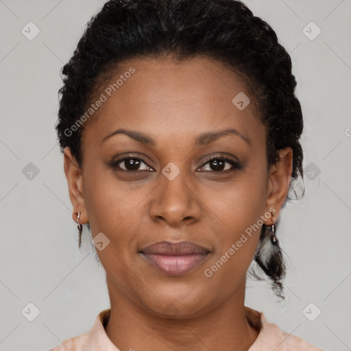 Joyful black adult female with short  brown hair and brown eyes