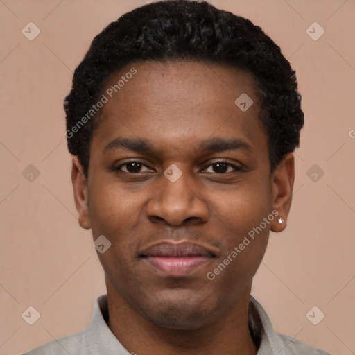 Joyful black young-adult male with short  black hair and brown eyes