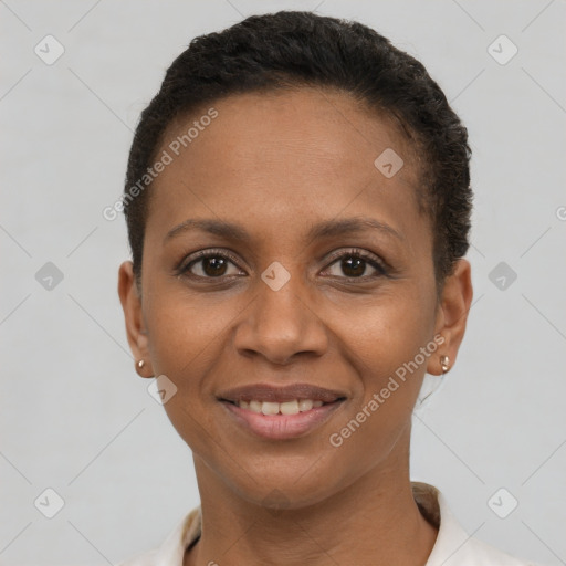 Joyful black young-adult female with short  brown hair and brown eyes