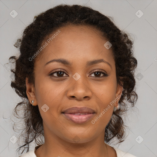 Joyful black adult female with medium  brown hair and brown eyes