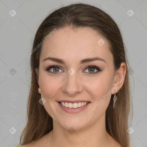 Joyful white young-adult female with medium  brown hair and green eyes