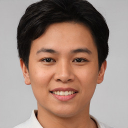 Joyful asian young-adult male with short  black hair and brown eyes