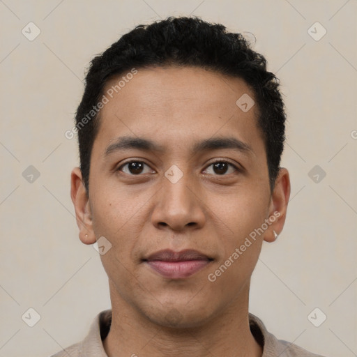 Joyful latino young-adult male with short  black hair and brown eyes