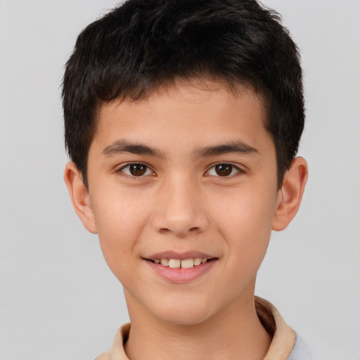 Joyful white child male with short  brown hair and brown eyes