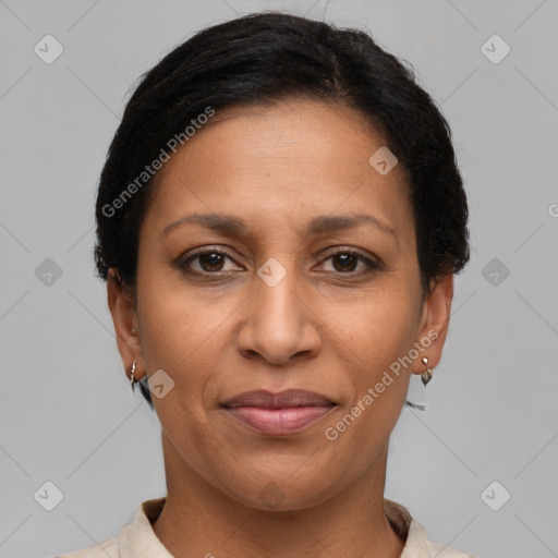 Joyful latino adult female with short  brown hair and brown eyes