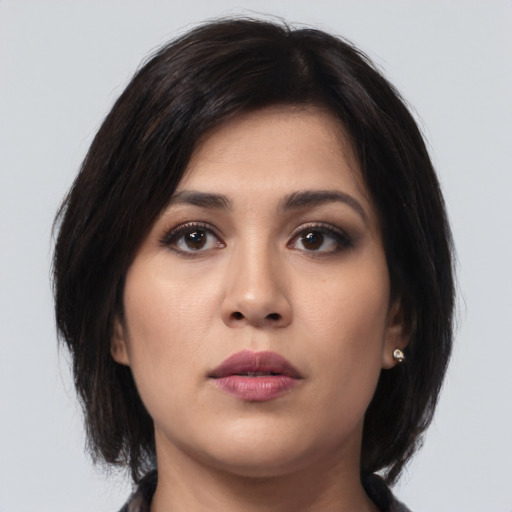 Neutral asian young-adult female with medium  brown hair and brown eyes