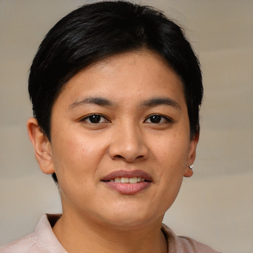 Joyful asian young-adult female with short  brown hair and brown eyes